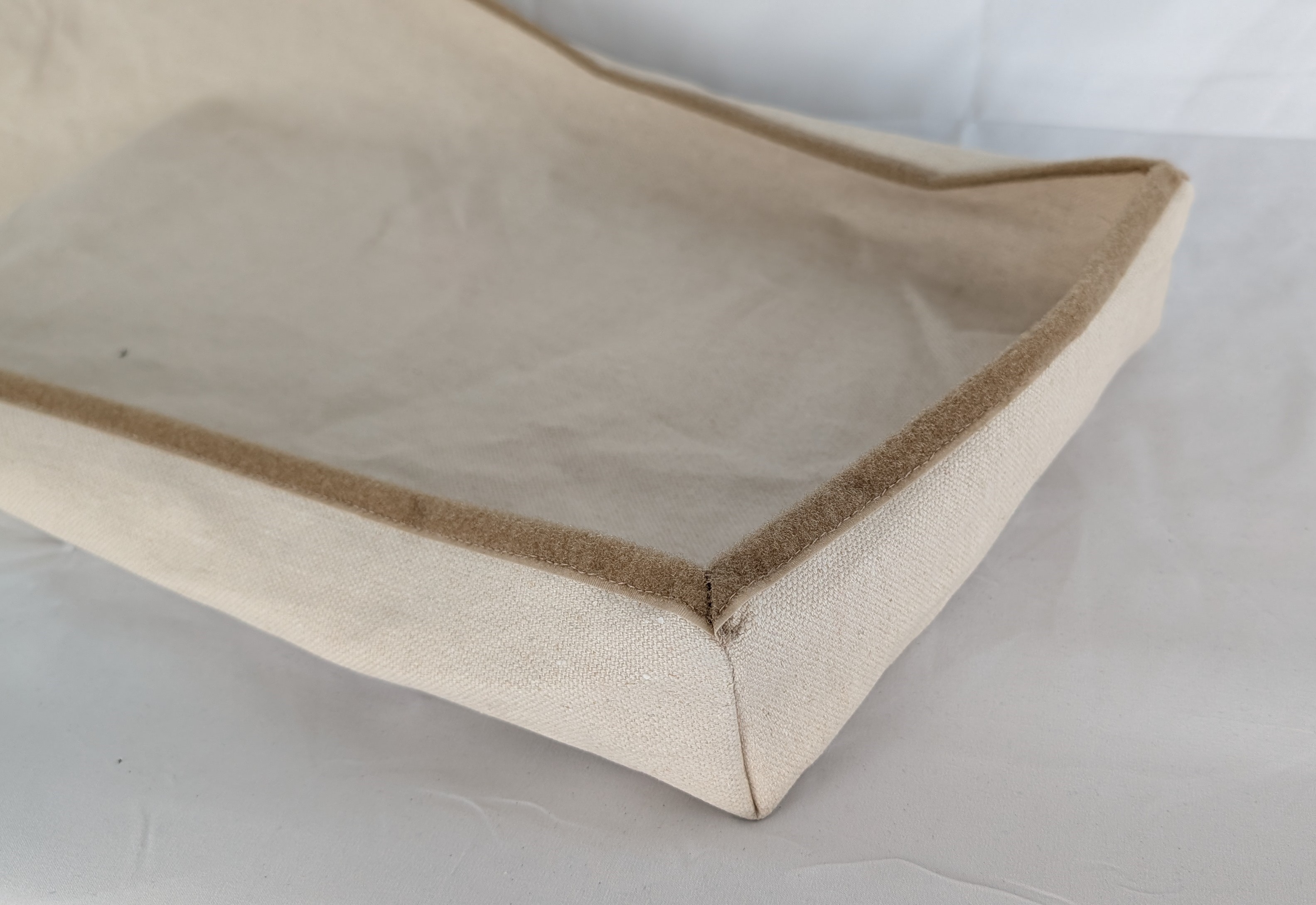 The organic canvas outer shell with Velcro closure open along the edge