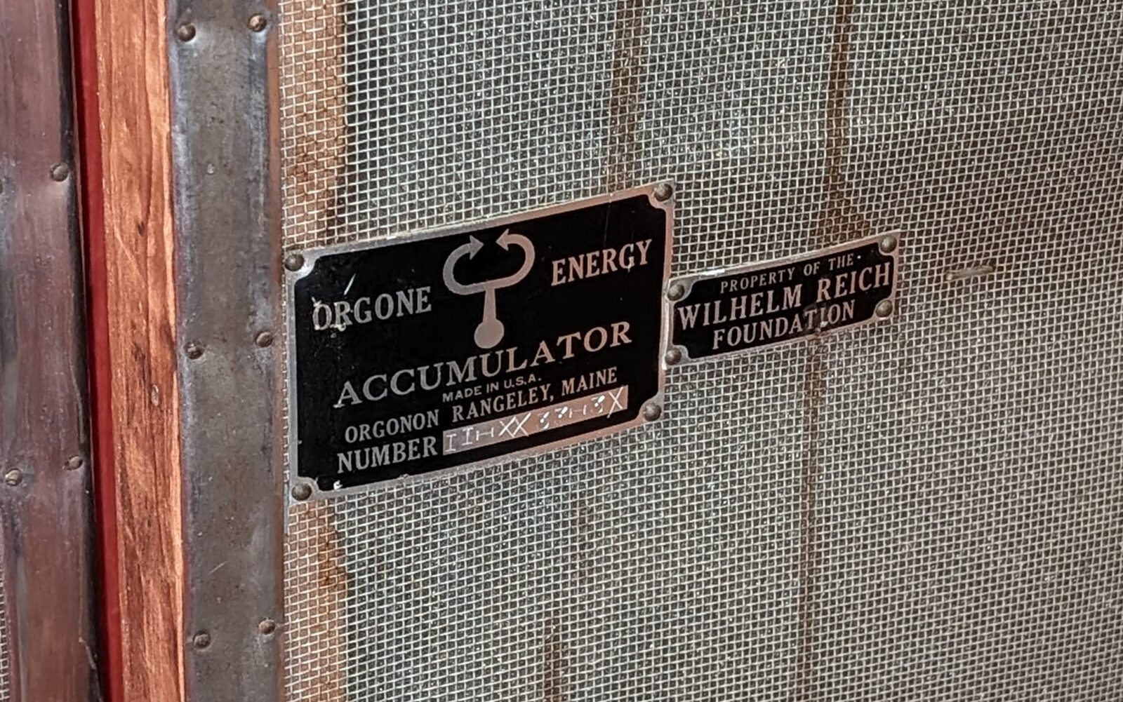 Original Orgone Energy Accumulator nameplate reading Orgonon, Rangeley, Maine, Property of the Wilhelm Reich Foundation